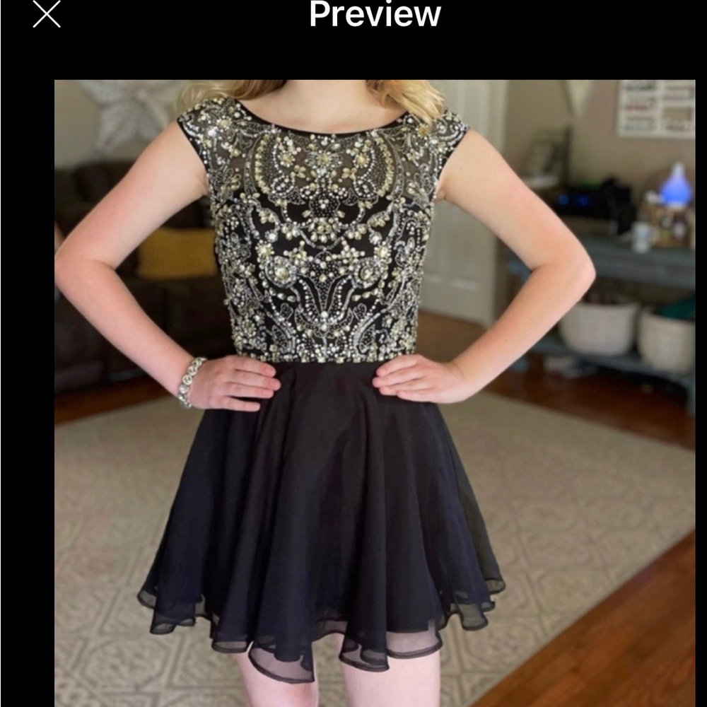Sherri Hill. Black Chiffon bottom, beading top. No alterations. Zipper. Size 2